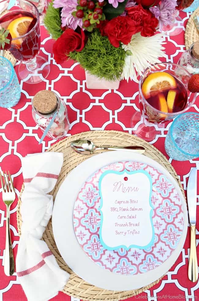 A modern summer dinner party tablescape to inspire your next soiree. Red and white place setting.