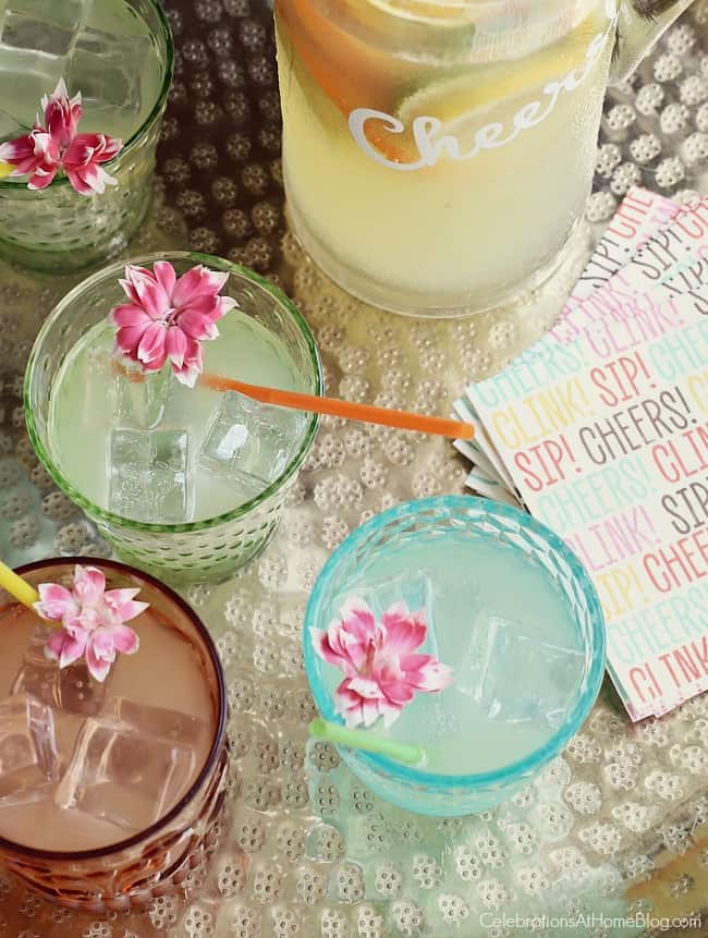 Host a Summer Cocktail Party and garnish drinks with pretty flowers.