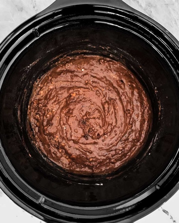 slow cooker brownie batter inside crock.