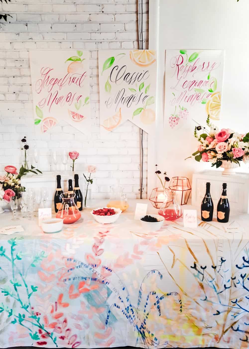 champagne bar set up with spring colors and flowers.