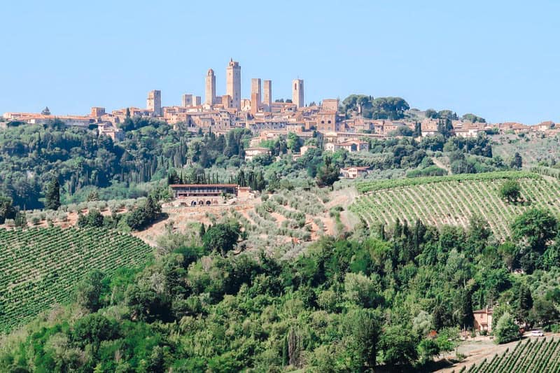 view of Tuscany hills and San Gimignano in the distance.