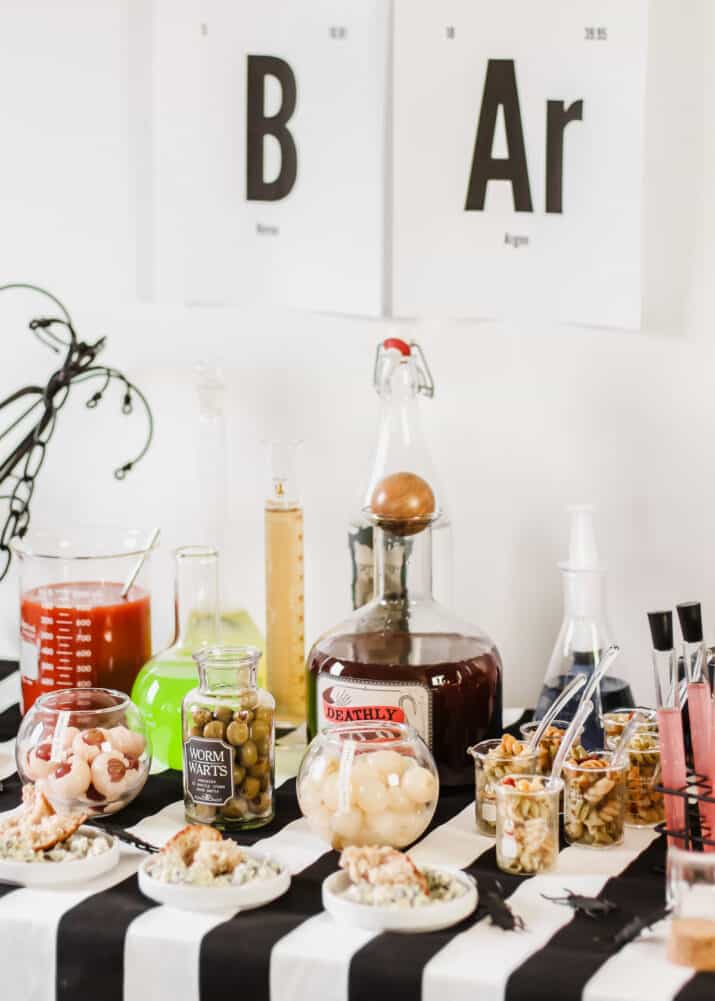 Halloween bar with science lab themed bottles.