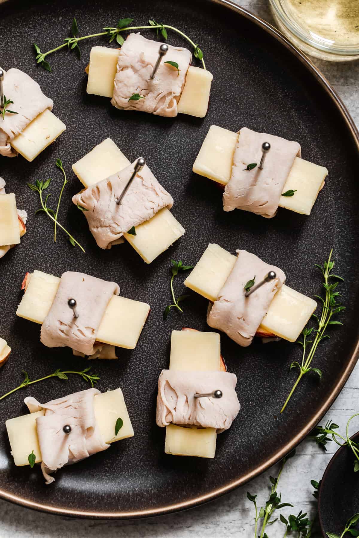 overhead view of bite size appetizers on dark plate