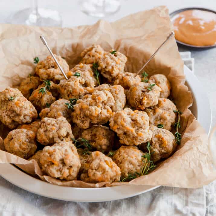 sausage cheese balls stacked on plate