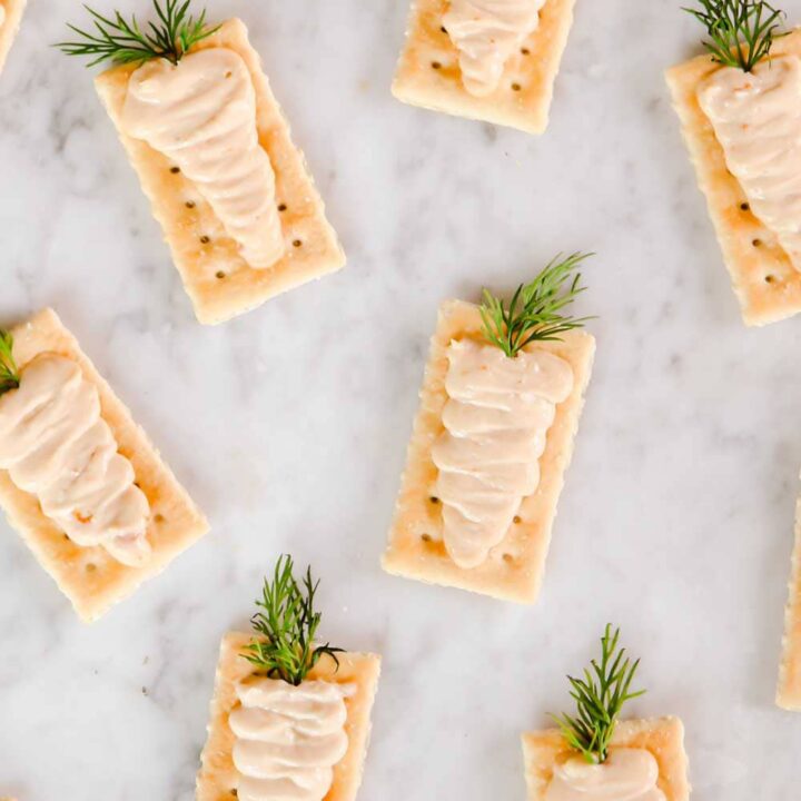 Club crackers with cream spread piped on top to look like carrots.