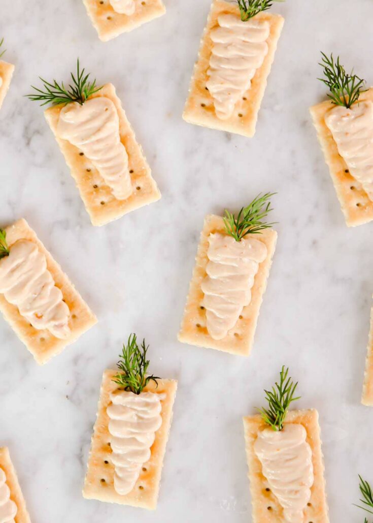 Club crackers with cream spread piped on top to look like carrots.