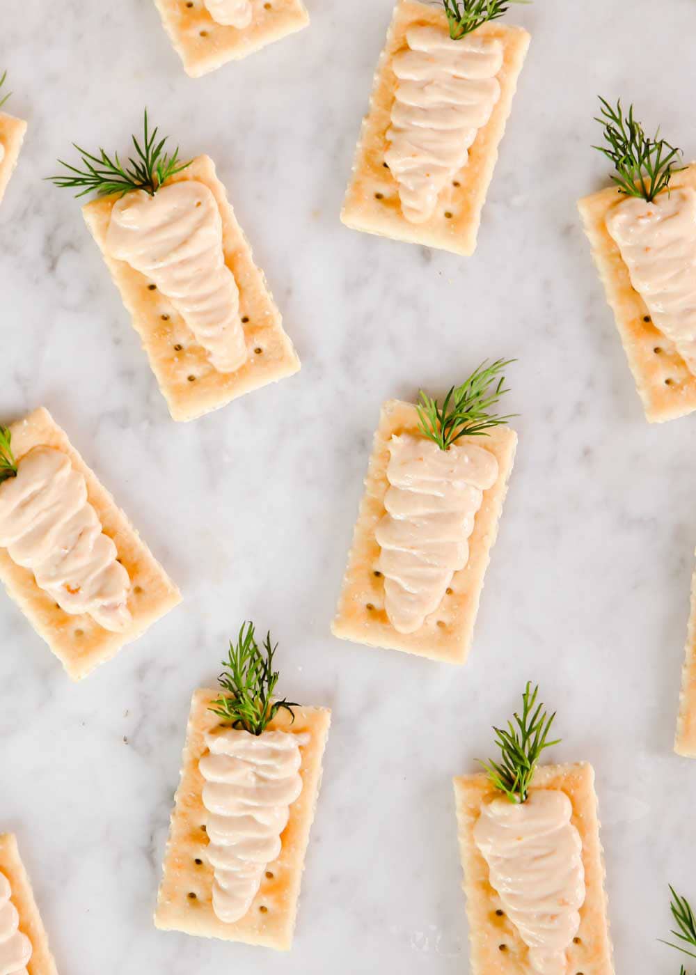 Club crackers with cream spread piped on top to look like carrots.