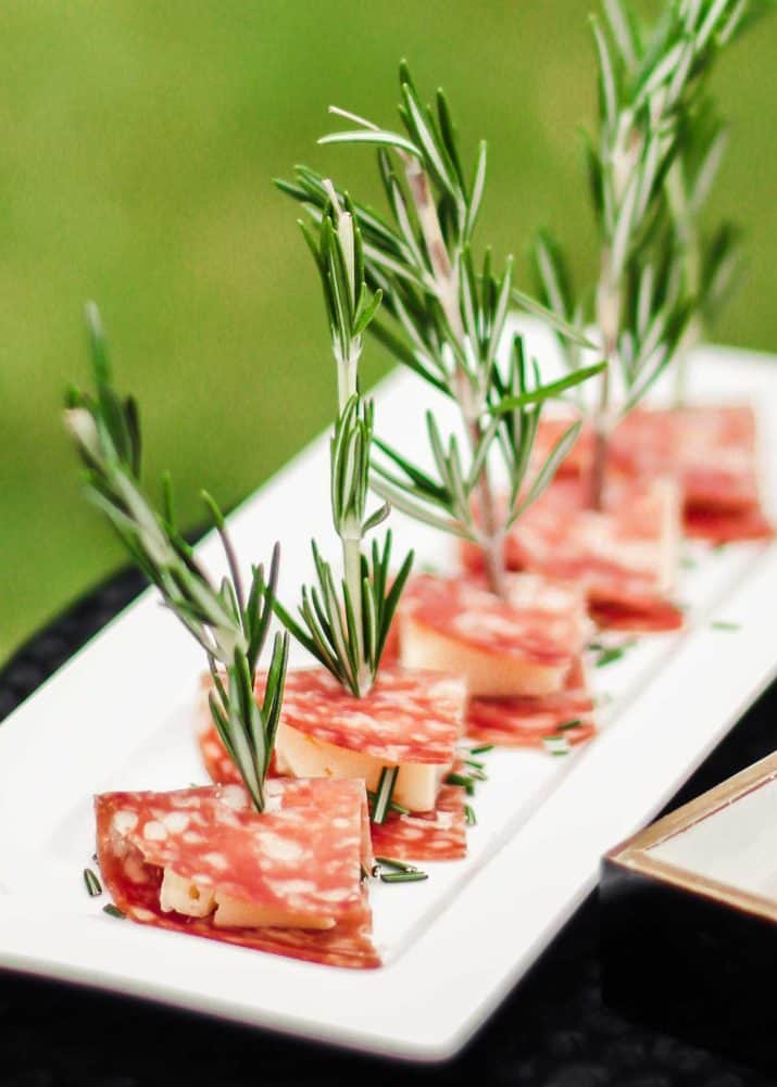 salami and cheese skewered on fresh rosemary stems.