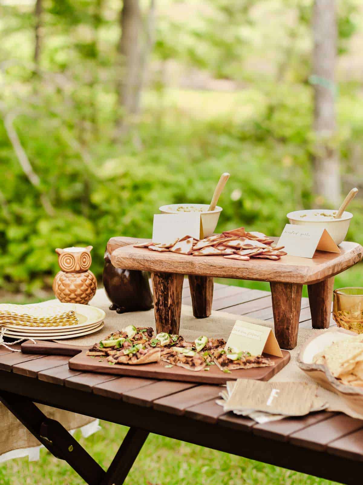 party table with food and drink set up outside.