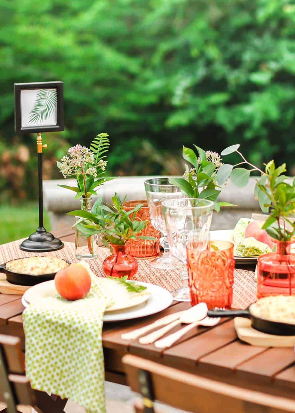 garden party tablescape, decorated with orange and green.