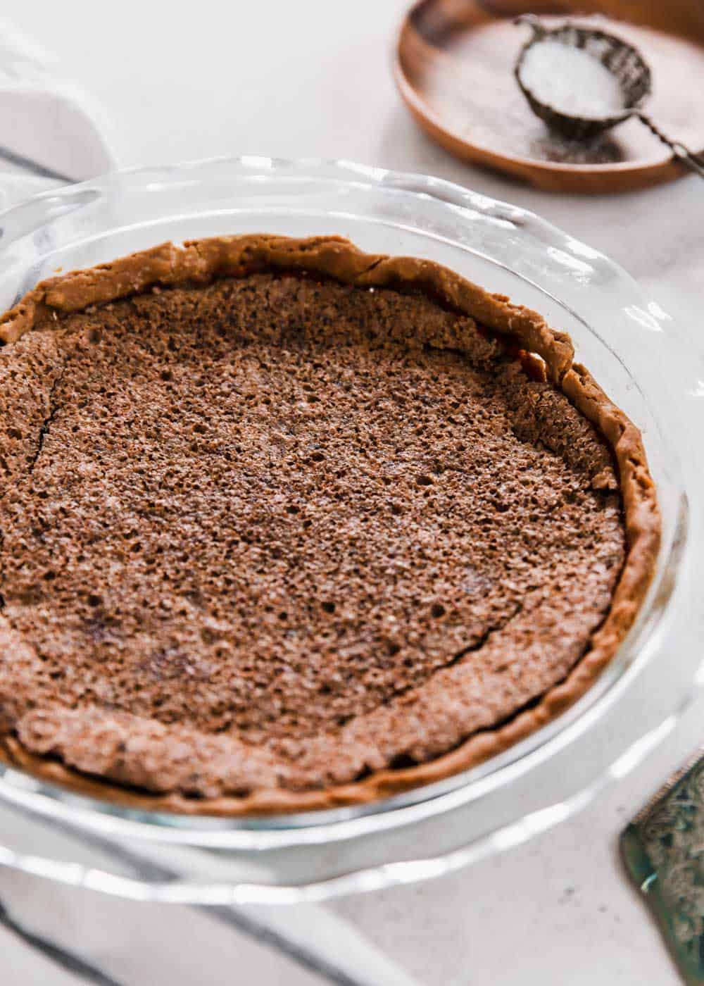 chocolate chess pie cooling without any topping or garnish.