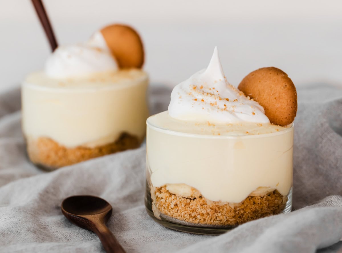 two banana pudding desserts in glass cups.