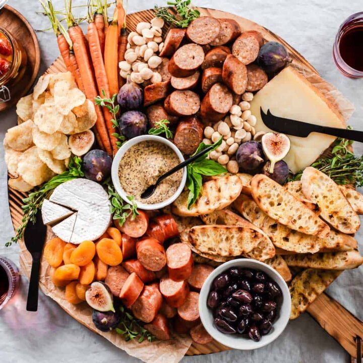 classic charcuterie board with smoke sausage bites, cheese, and accoutrements.
