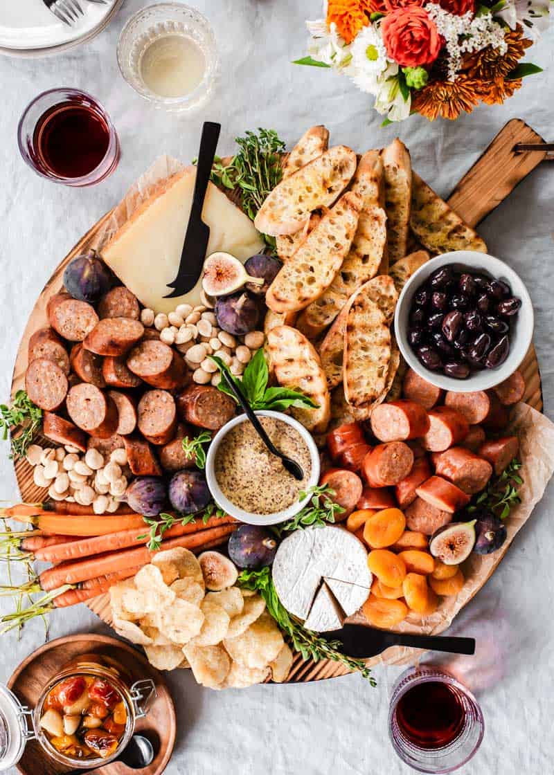 classic charcuterie board with smoke sausage bites, cheese, and accoutrements. 