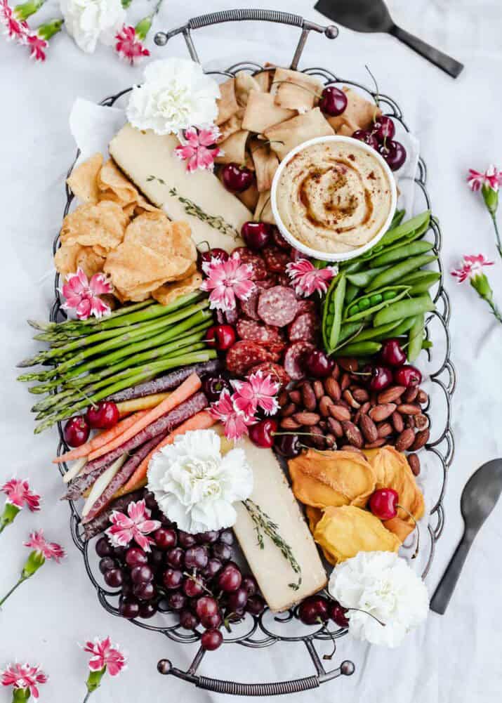 charcuterie tray with dips and vegetables included.