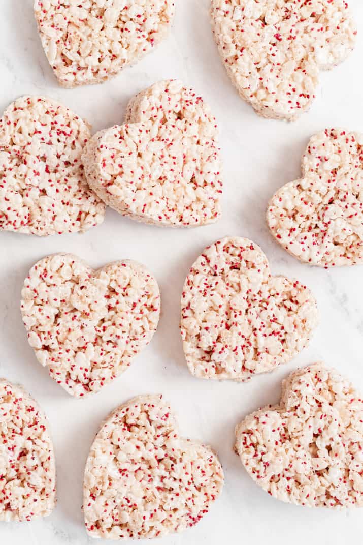 heart shaped rice crispy treats on marble background, overhead