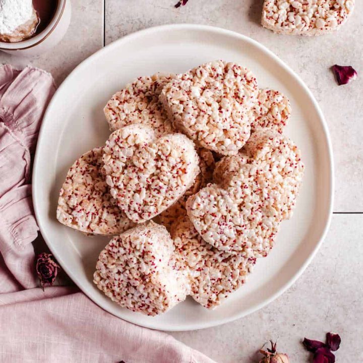 heart shaped rice krispies treats piled on a plate.