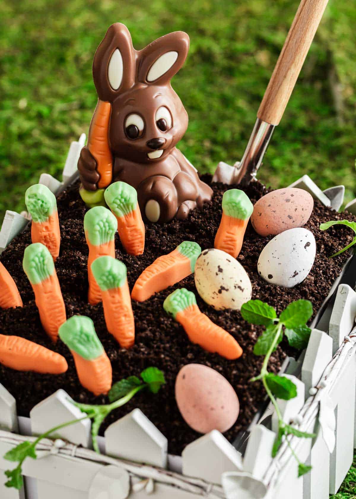 close up of Easter dirt cake with chocolate bunny and candy carrots.