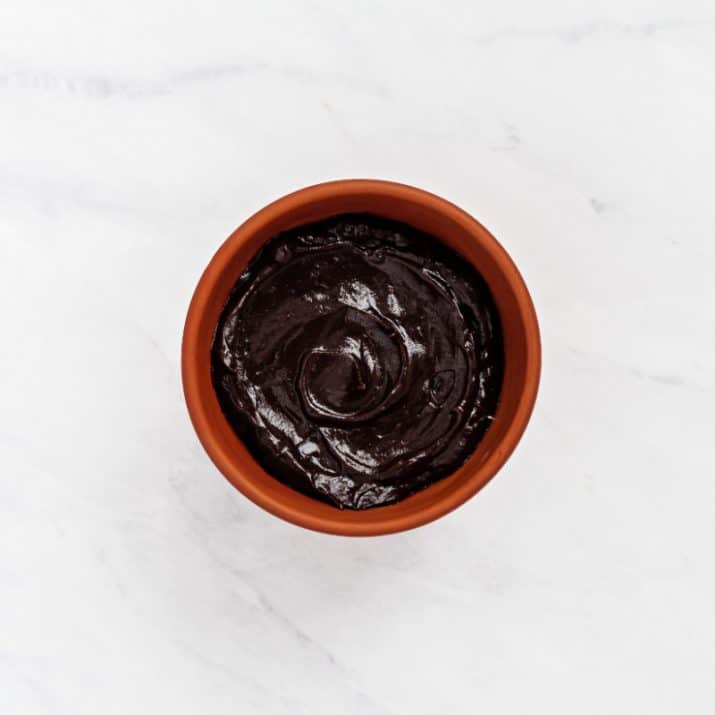 chocolate pudding mixture in mini terra cotta pot.