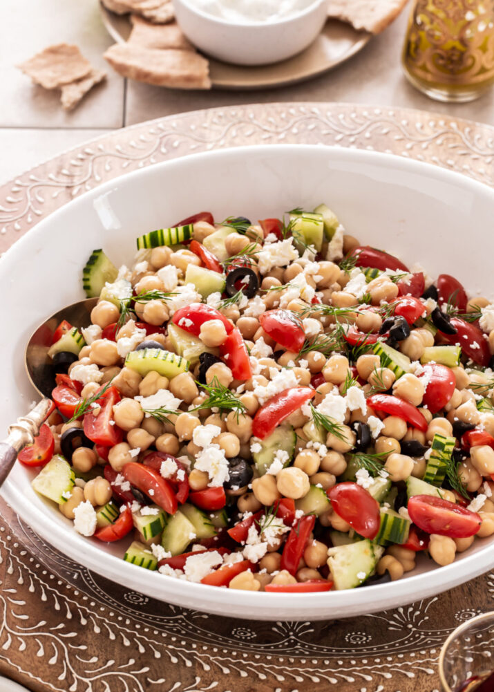 chickpea salad in white serving bowl.