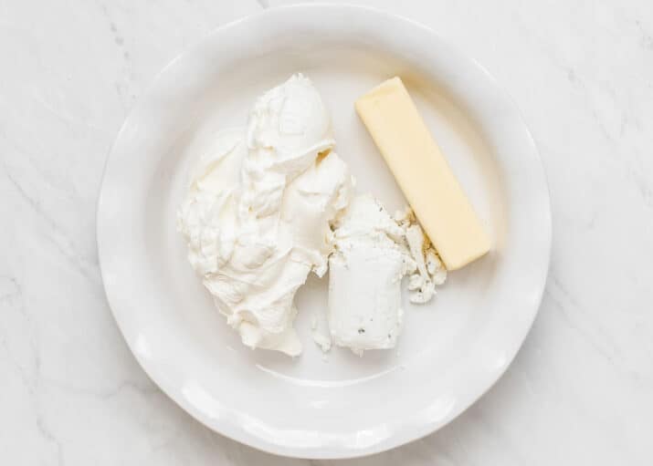 ingredients for corn dip in white dish.