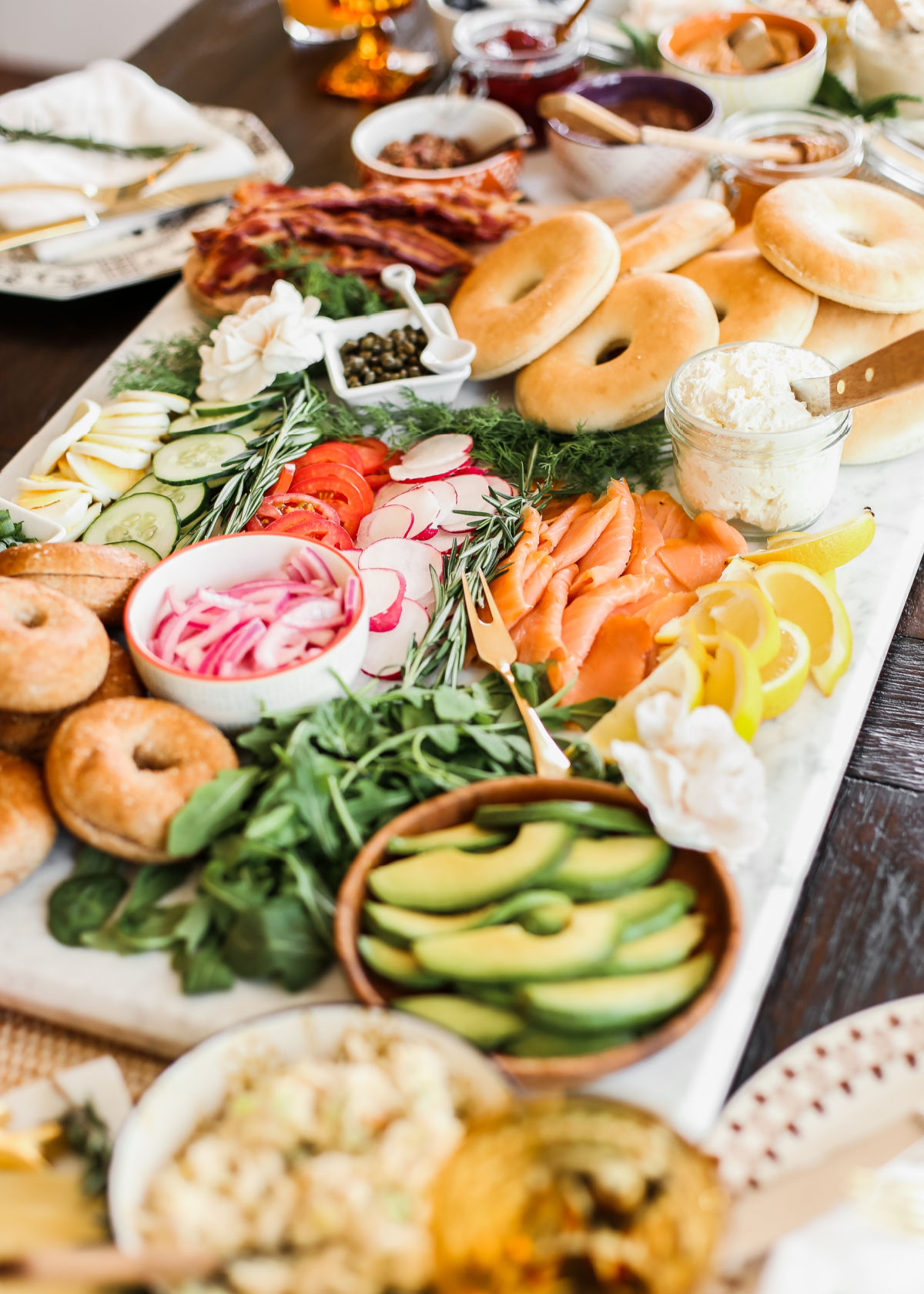 bagel bar table full of toppings.