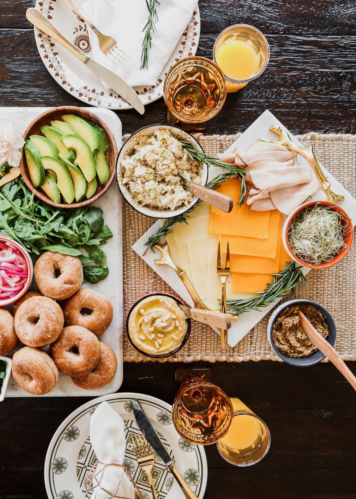 bagel sandwich ideas on a table, overhead view.