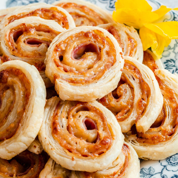 puff pastry pinwheels piled high, close up.