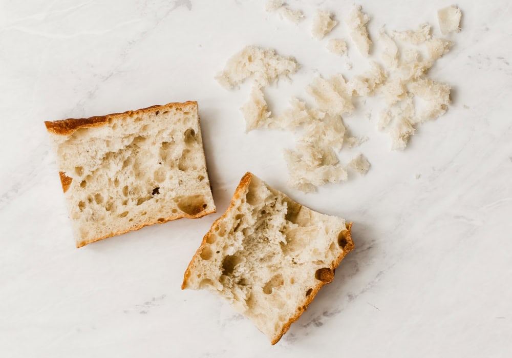 crusty bread slices with the soft center pulled out.