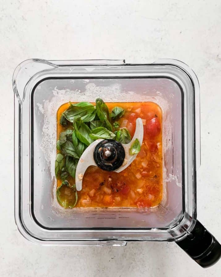 ingredients for tomato soup in a blender.
