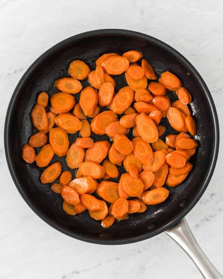 making glazed carrots in a skillet.