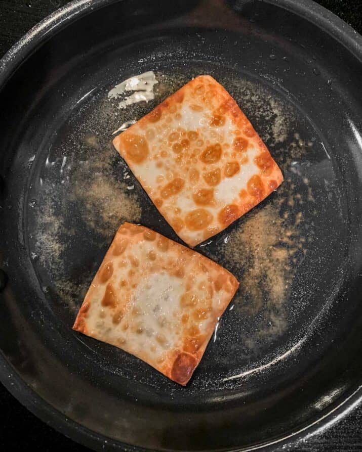frying wontons in a nonstick pan.
